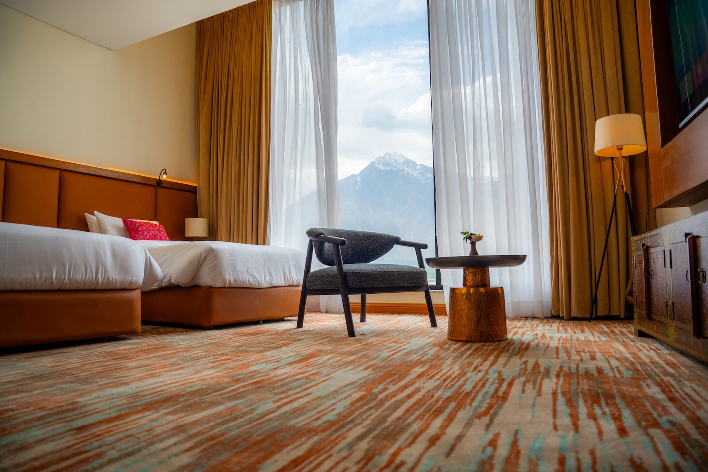 Deluxe Double Room at FortuNorth with queen bed and mountain views